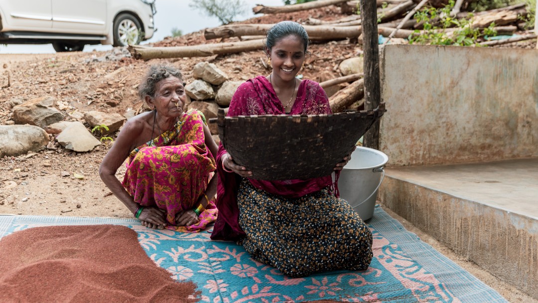 Two women seven ragi seeds