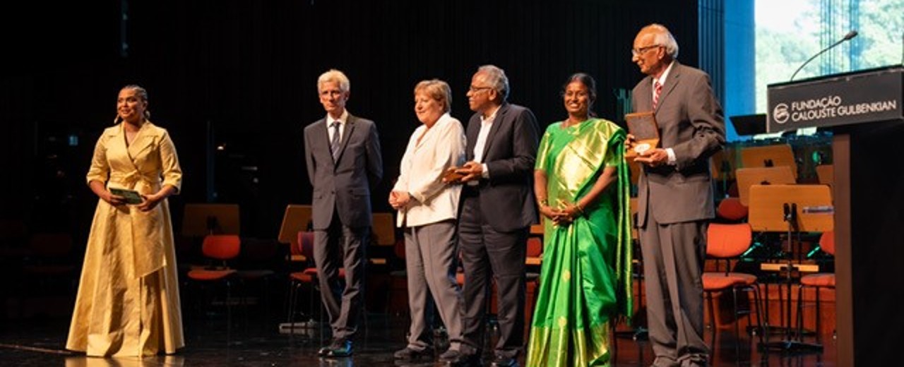 Award ceremony with prizewinners and Angela Merkel on stage