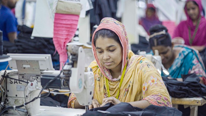 Woman sewing in a factory