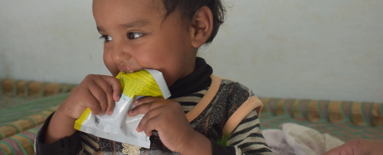 A child eats the nutrition product Wawamum against malnutrition