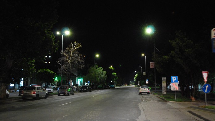 A street illuminated by LED street lamps at night.